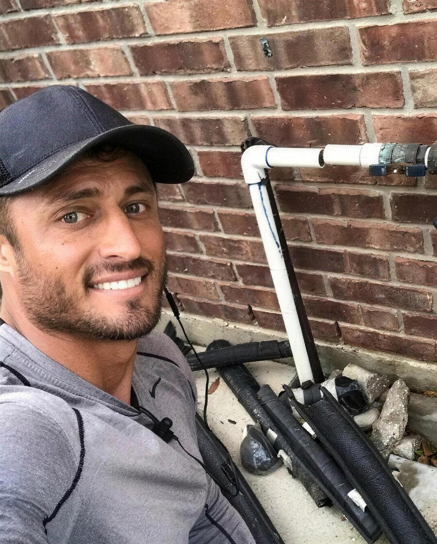 Chris Smith, founder and owner of Elite Sprinkler Services, on a job in Katy, TX