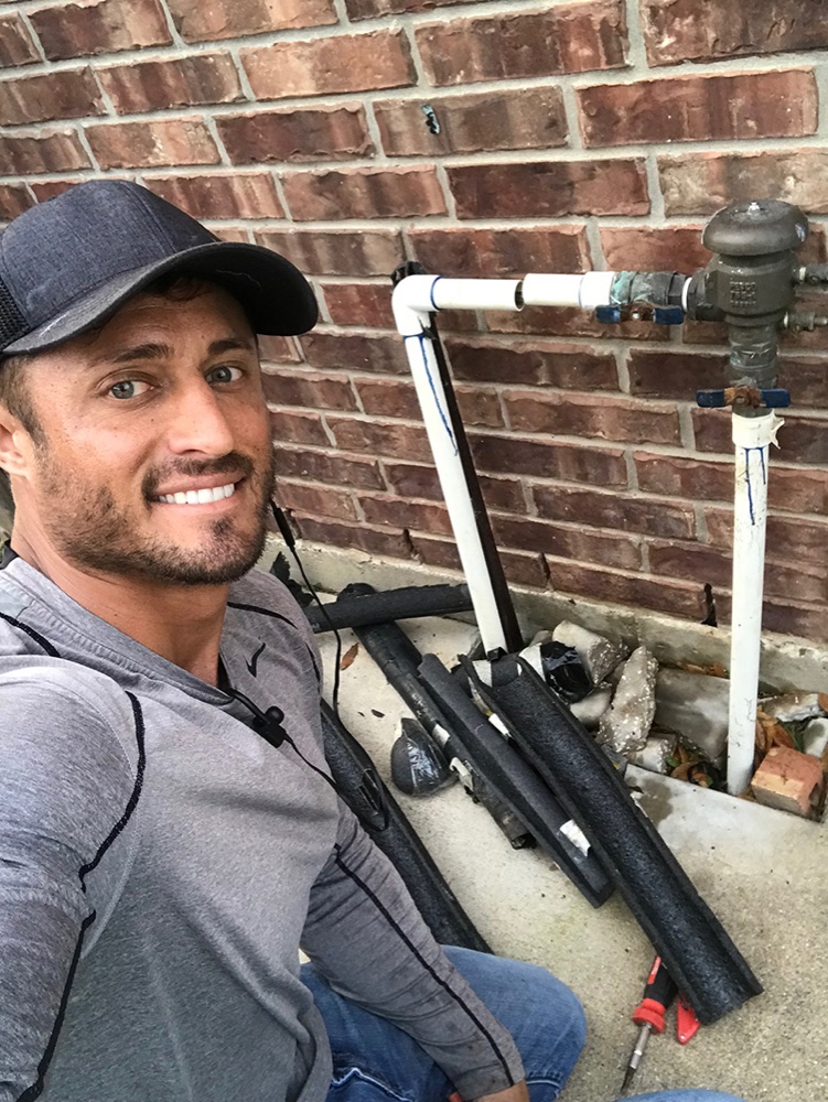 Elite Sprinkler technician on an irrigation repair at a Katy, TX home