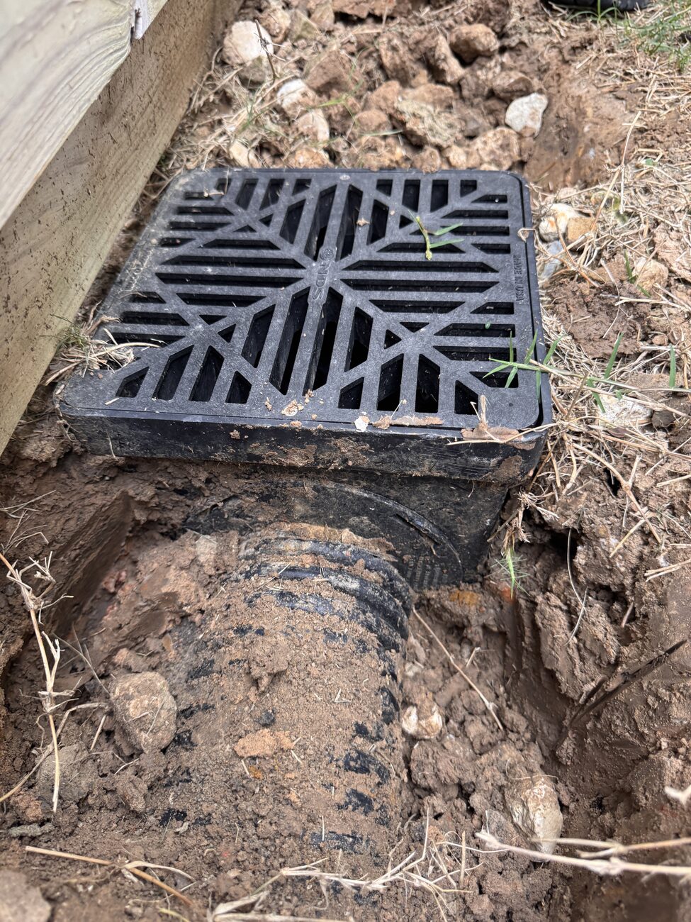 A drainage grate installed on a Katy job